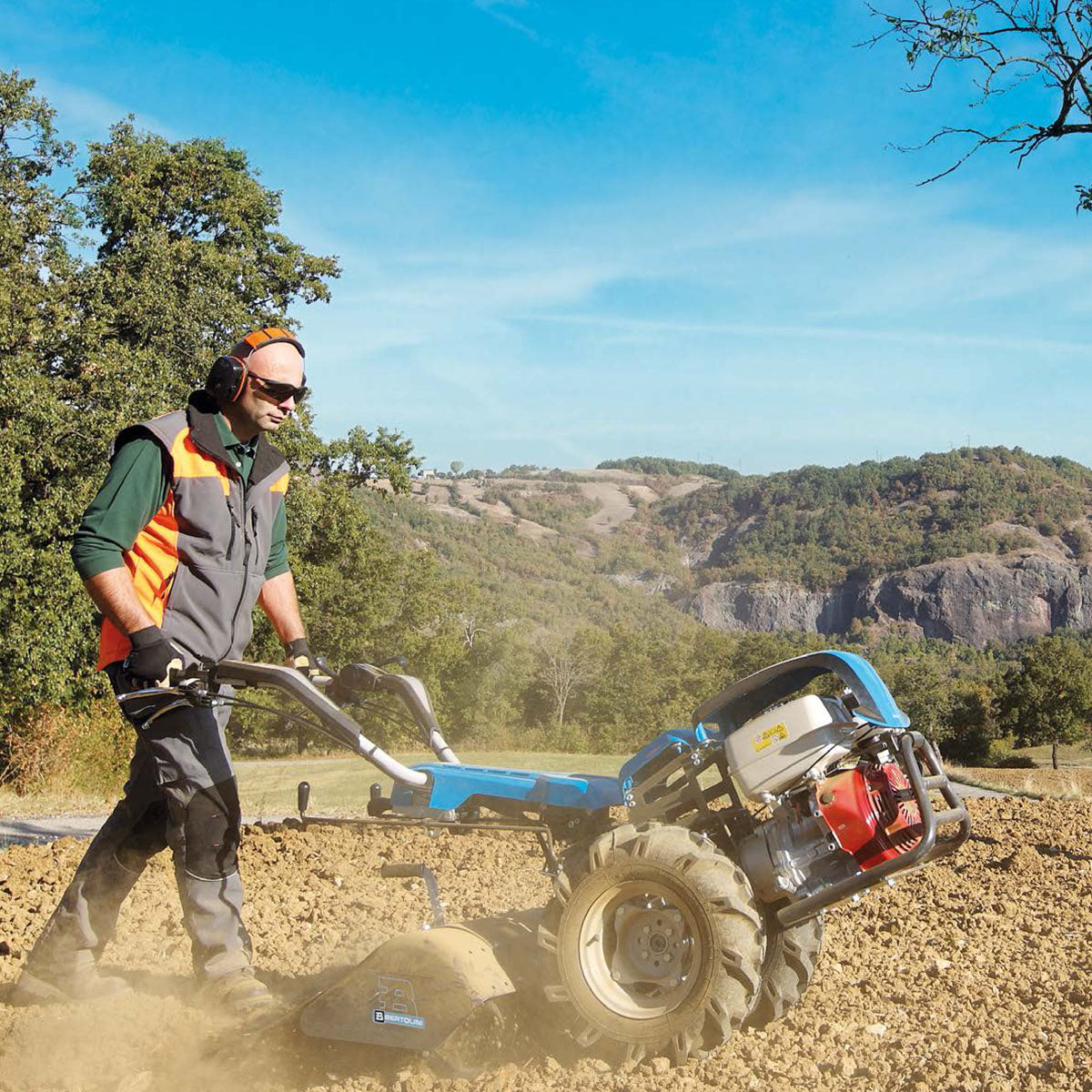 Bertolini 417 two-wheel walk-behind tractor performing ground cultivation with rototiller